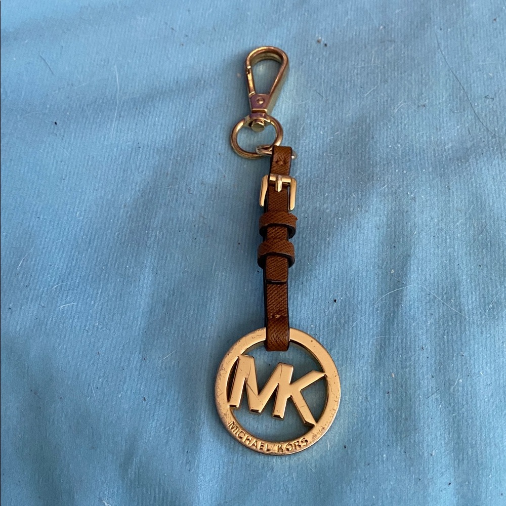 Michael Kors bag charm in pre-owned condition